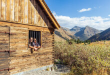 two people exploring the old mining jail at Animas Forks on a Silverton Jeep Tour