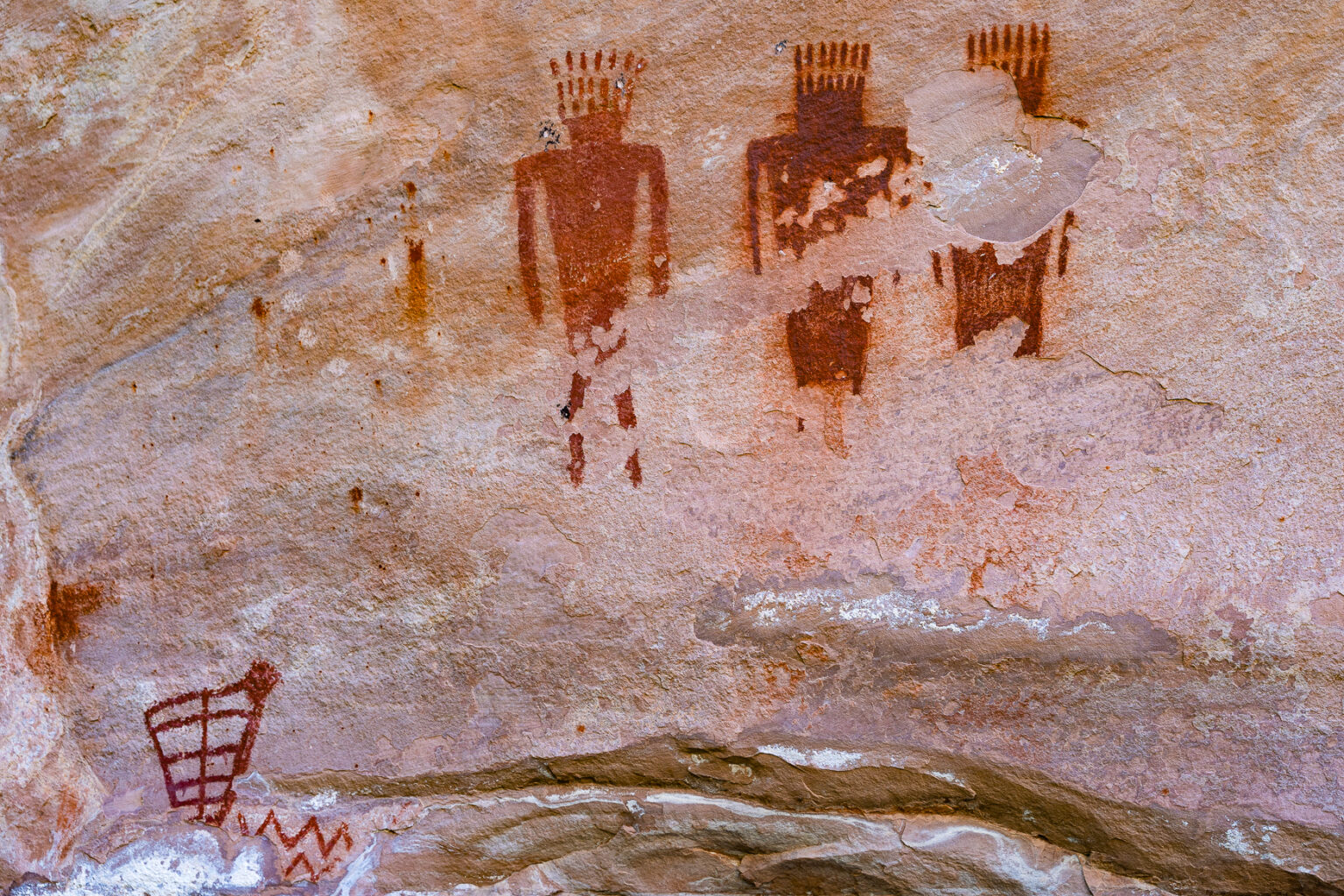 Three pictograph figures along the Jones Hole Trail in Dinosaur National Monument - Mild to Wild