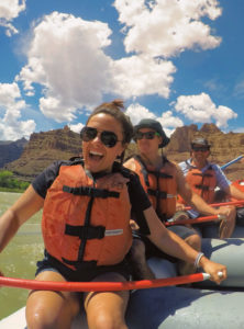 customer smiling on the Colorado river near Moab