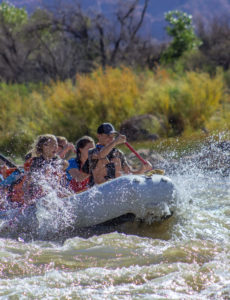 rafting through onion creek rapid on the colorado river