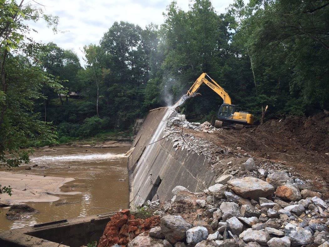 Tractor taking down a dam - American Rivers - Mild to Wild