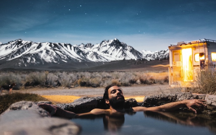 Man soaking in Hot Spring - Mild to Wild