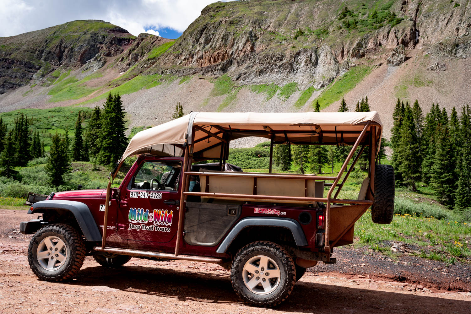 A maroon Jeep from Mild to Wild in the La Plata Mountains outside of Durango, CO - Mild to Wild Durango Jeep Tour