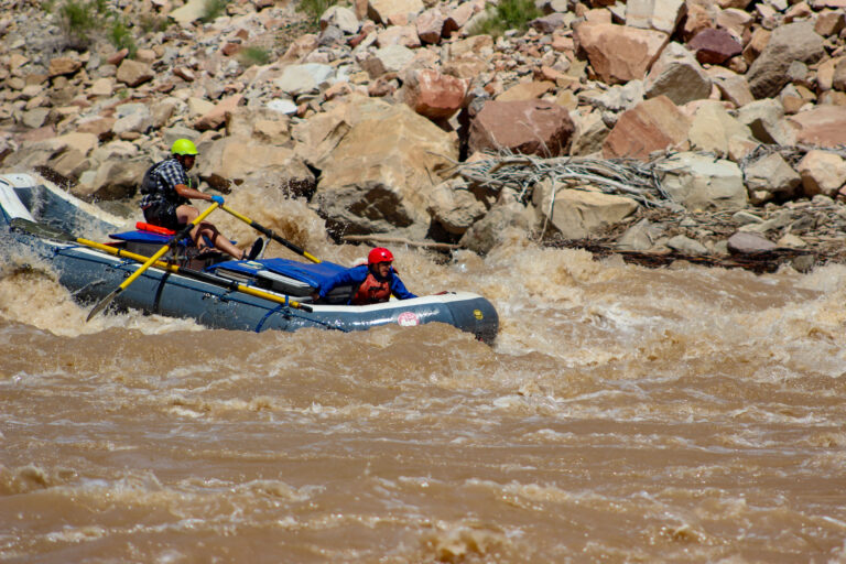 Cataract Canyon - Close up of raft going through white water