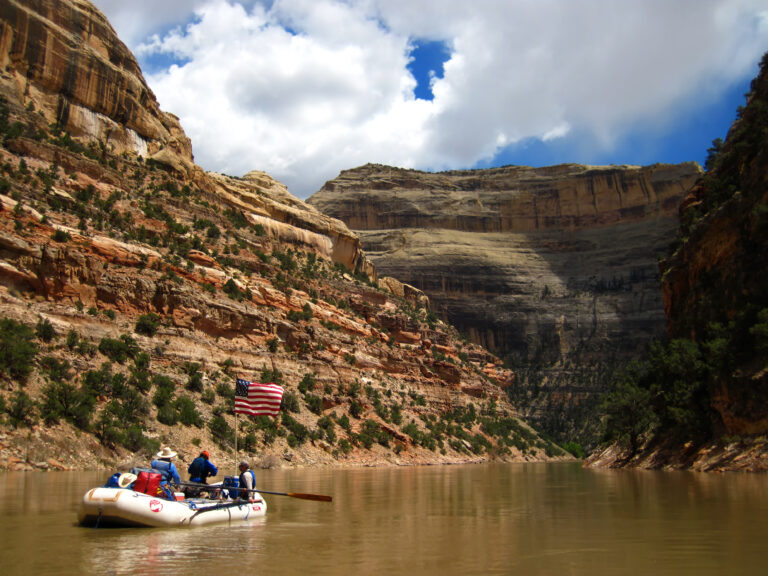 Yampa river rafting - medium shot of raft in the canyon