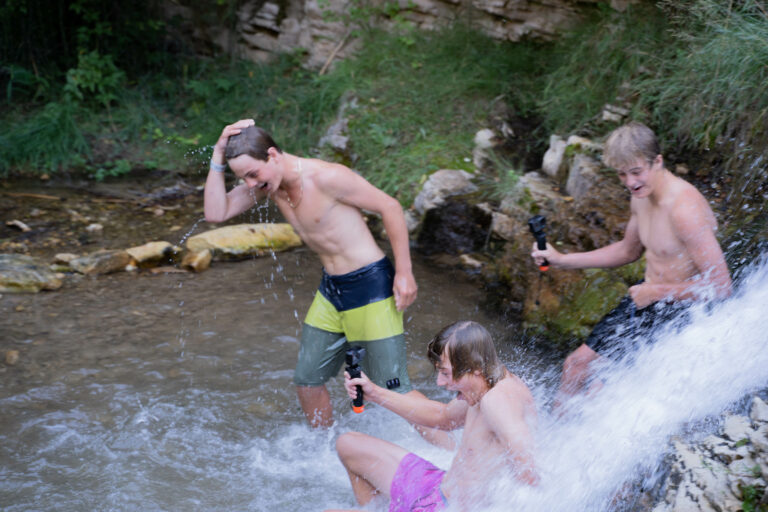 Gates of Lodore - Ely Creek Falls - Kids getting splashed by waterfall