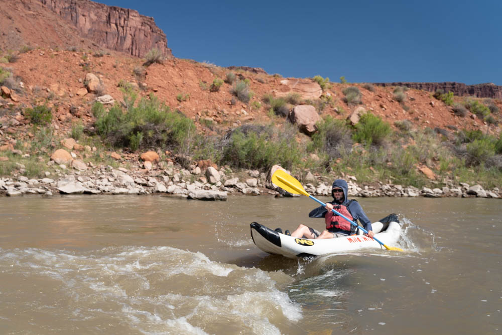 Castle Valley - Close up of kayaker going down rapids