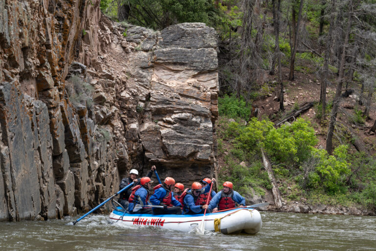 Upper Piedra River Section - Medium shot of raft next to granite wall - Mild to Wild