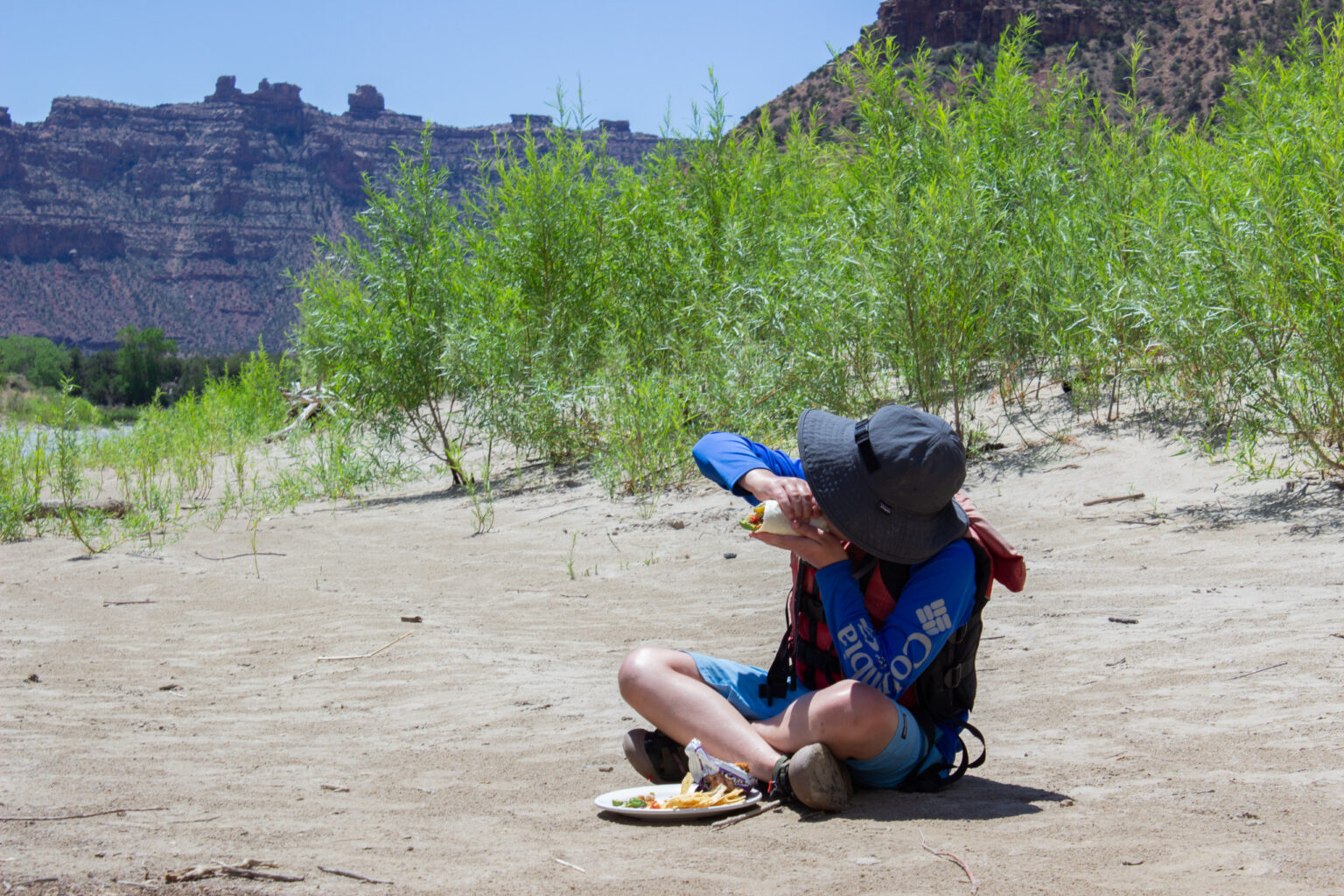 Desolation Canyon - Kid Eating Burrito At Camp - Mild to Wild