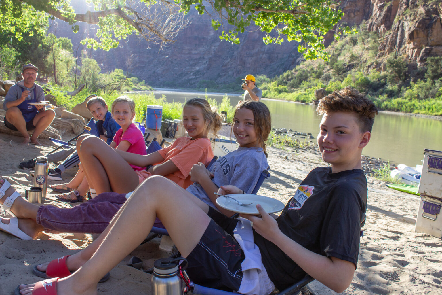 Kids eating breakfast under cottonwoods in Desolation Canyon - Mild to Wild