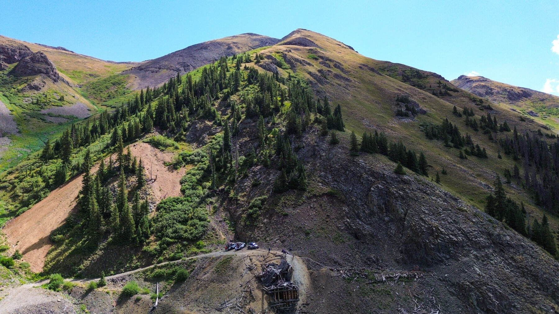 aerial view of the top of a mine at the top of mini gulch with mountains and jeep in background - Silverton, CO - Mild to Wild