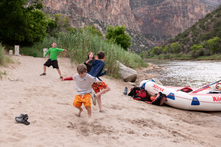 four kids playing in the sand at camp - Gates of Lodore - Mild to Wild