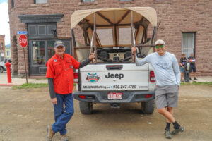 Mild to Wild jeep guides standing in front of jeep in downtown Silverton