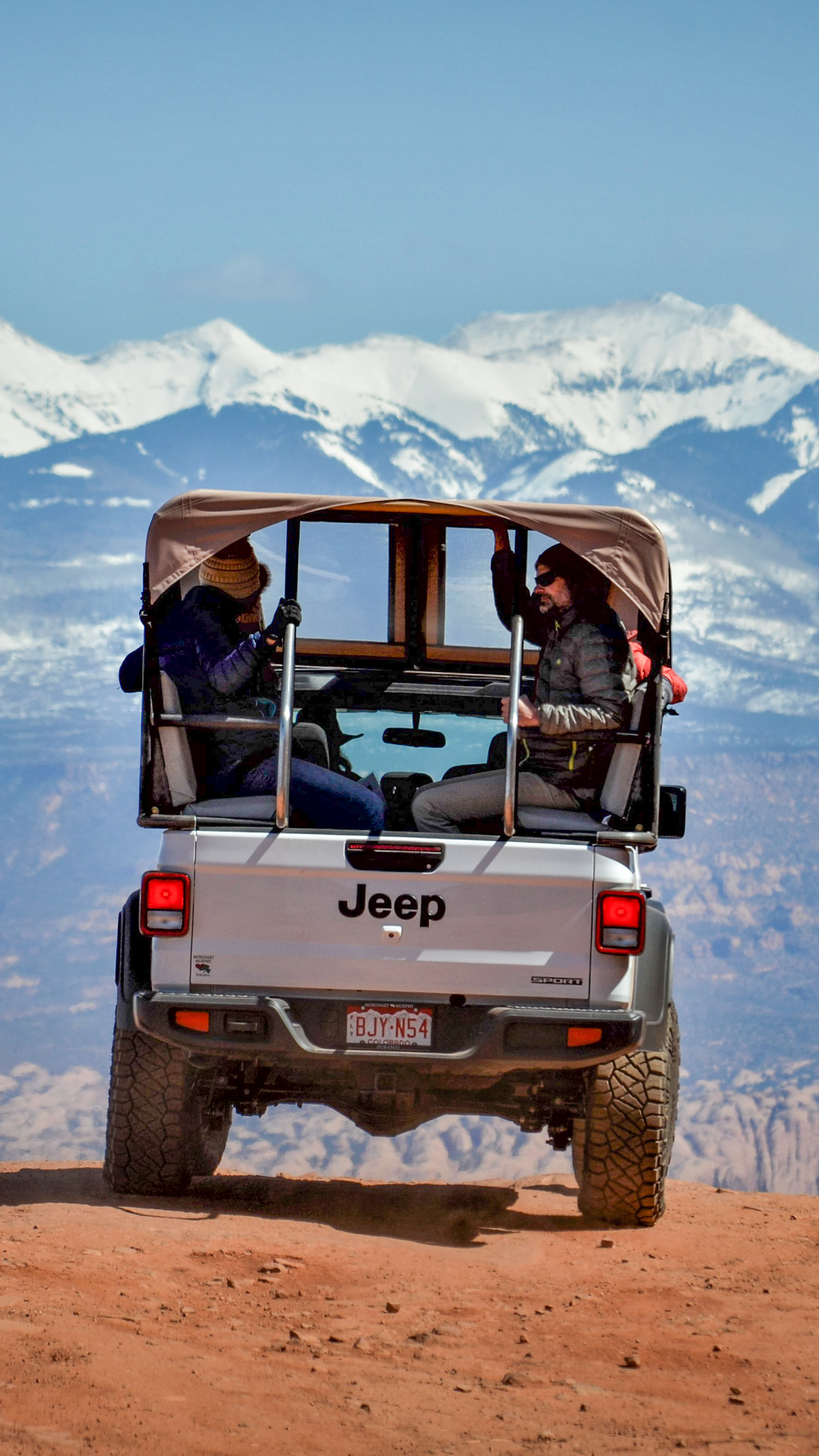 Jeep Gladiator riding into the mountain on desert road - Mild to Wild