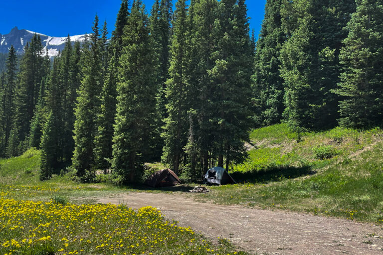 Two tents along a dirt road in the mountains near Telluride, CO