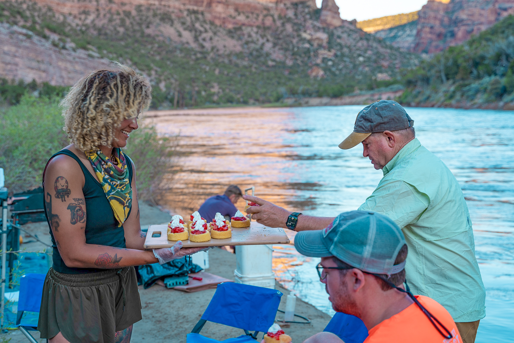 Guide serving up dessert to a guest on a Yampa River trip in Dinosaur National Monument - Mild to Wild