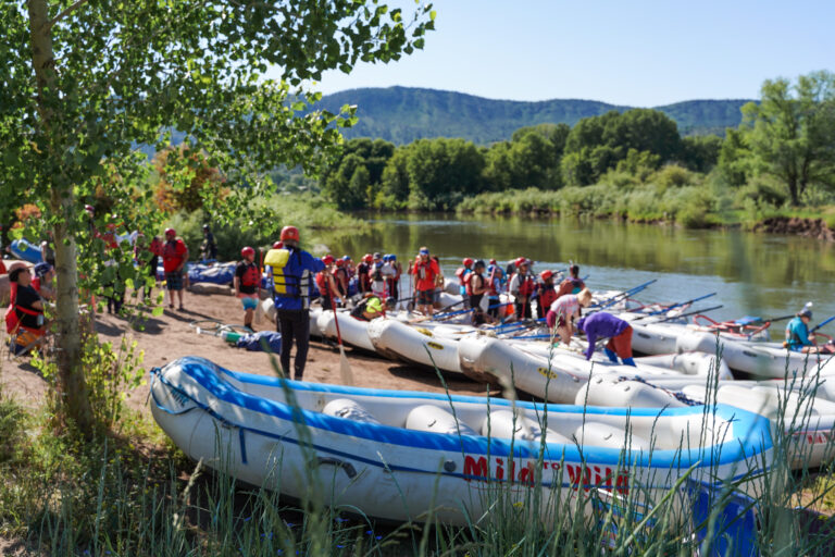 Boats putting in to the Animas River for a Durango rafting trip at Oxbow Park