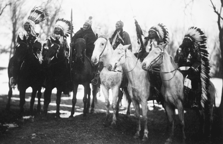 1890 photo of Indigenous Tribal leaders on horseback