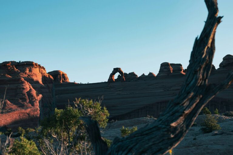 Shaded view of Delicate Arch in the evening from the Upper Viewpoint area in Arches National Park